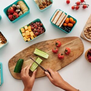 Overhead view of fresh fruit and vegetables being prepared for a healthy lunch.